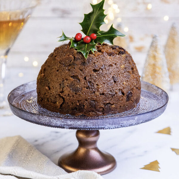 The Warings Bakery Christmas Pudding displayed on a cake stand