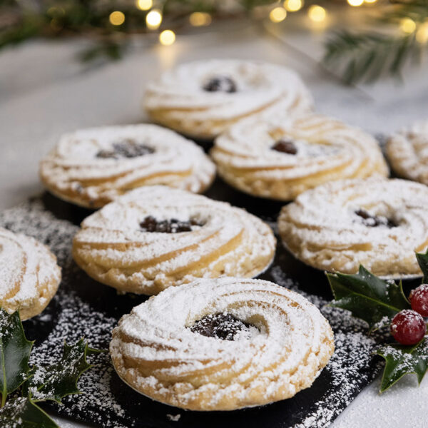 Six Luxury Viennese Mince Pies displayed on slate, dusted with icing sugar